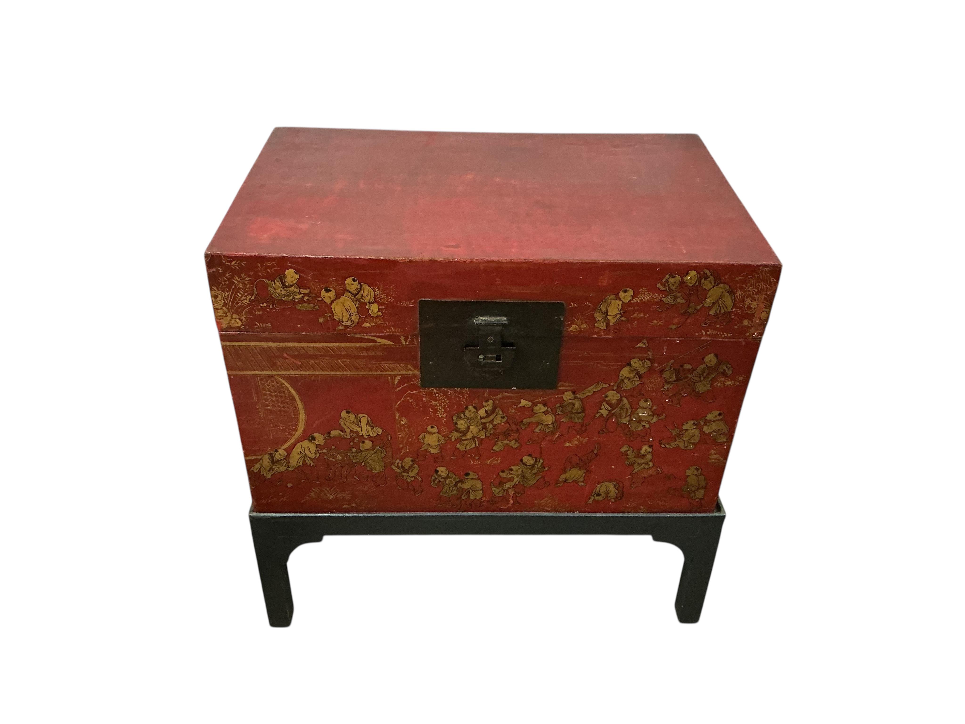 A Chinese scarlet lacquer trunk on stand, width 83cm, depth 53cm, height 84cm